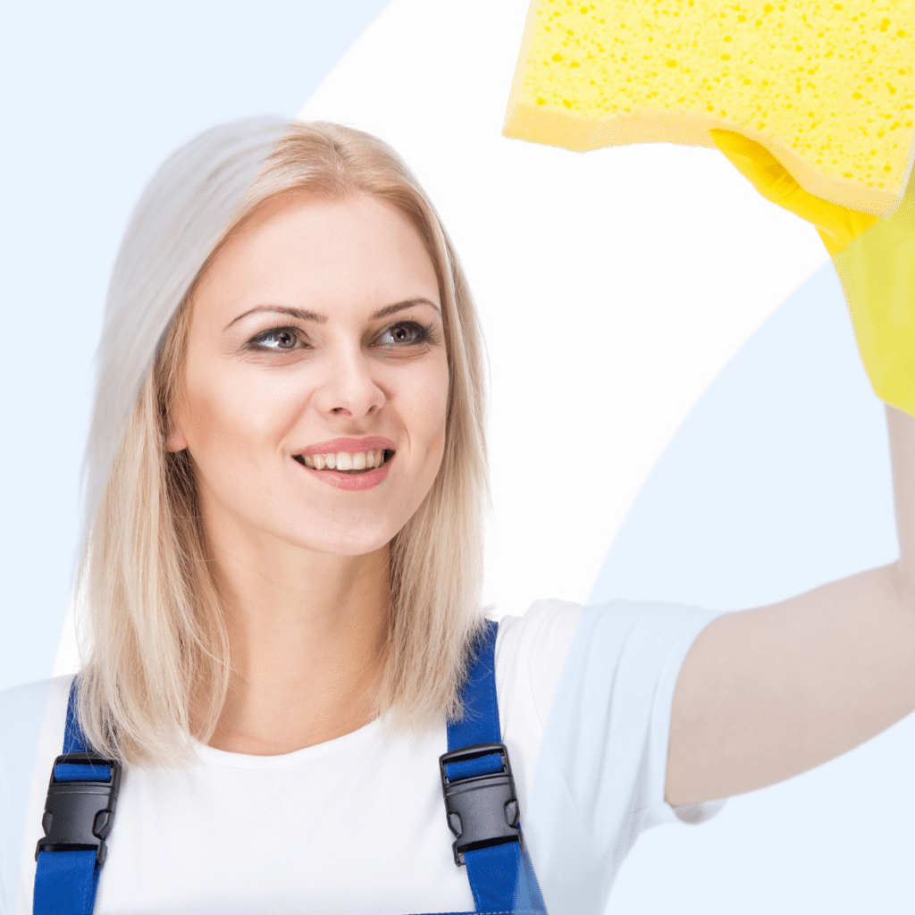 woman cleaning window with sponge