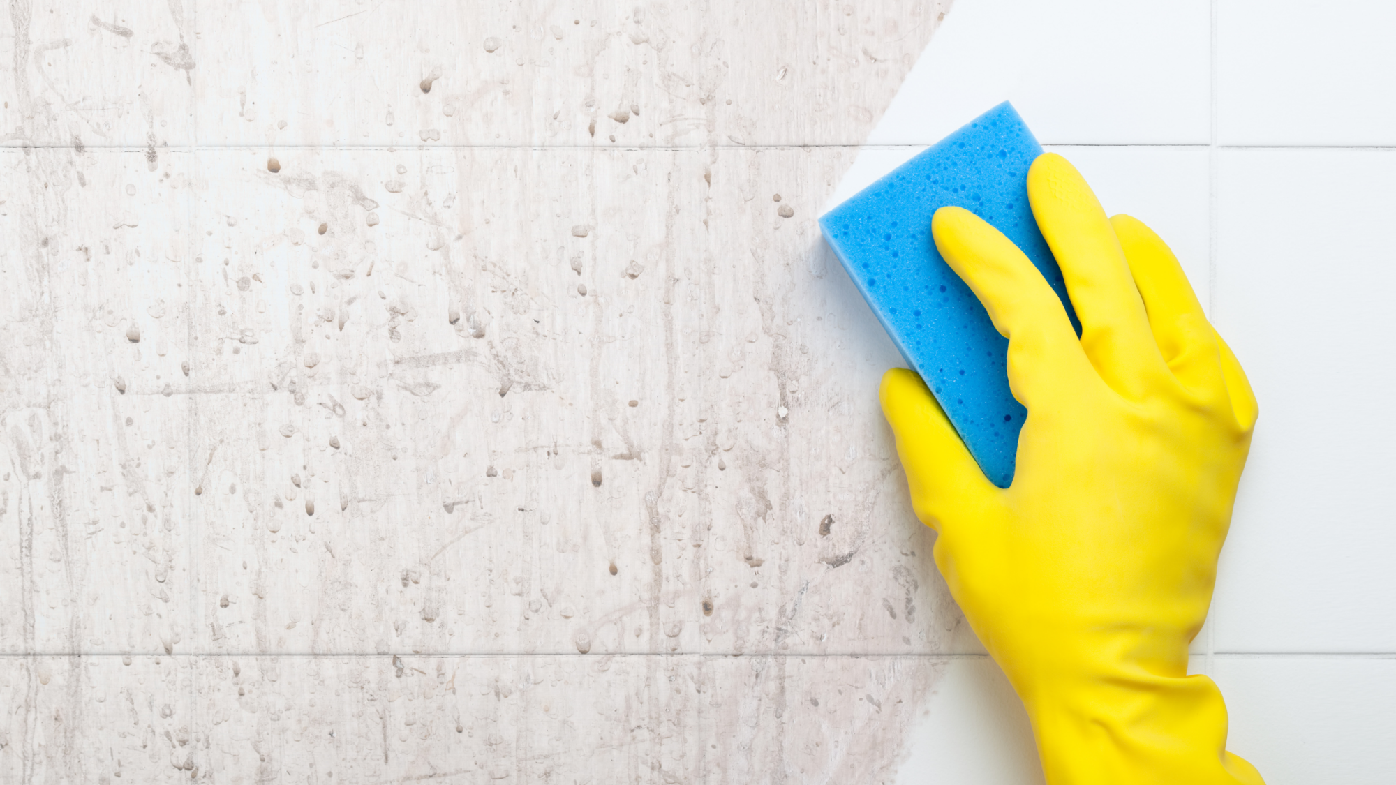 scrubbing down a shower with sponge